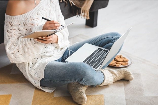 a female is working in her laptop for website testing