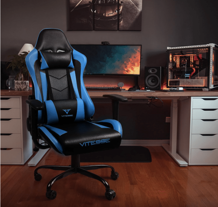 gaming chair blue color with curved monitor and speaker in the background